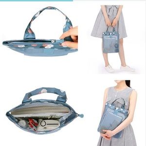 Blue mesh travel bag with zipper closure and flower print on top